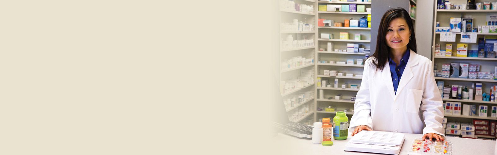 A pharmacist sorting and organizing several prescriptions