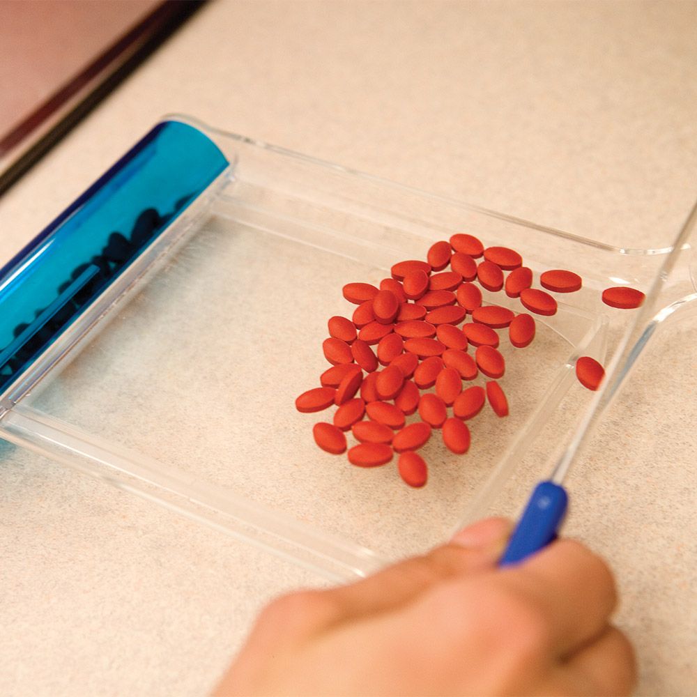 Pharmacist filling prescription