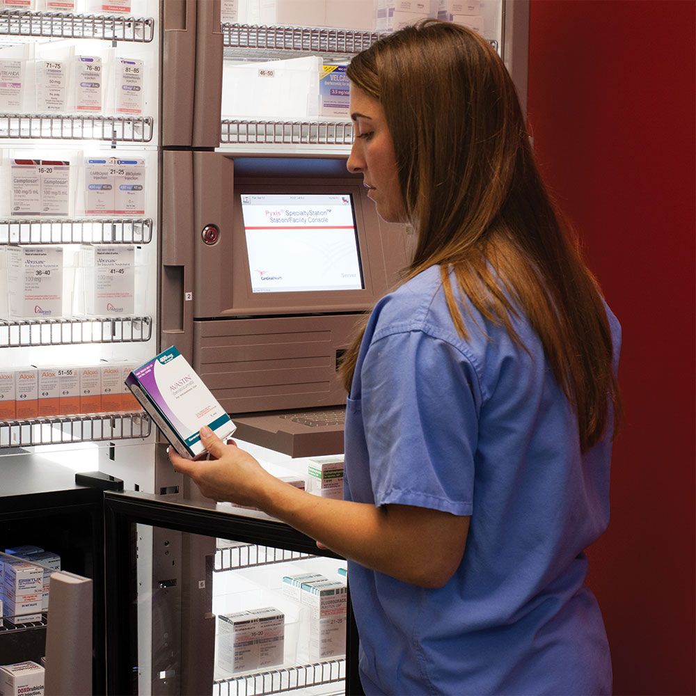 pharmacist at computer in hospital pharmacy