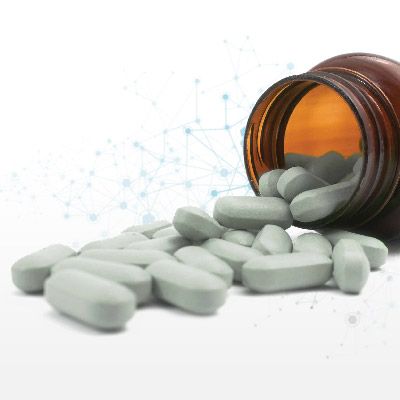 pills spilling out of orange prescription bottle