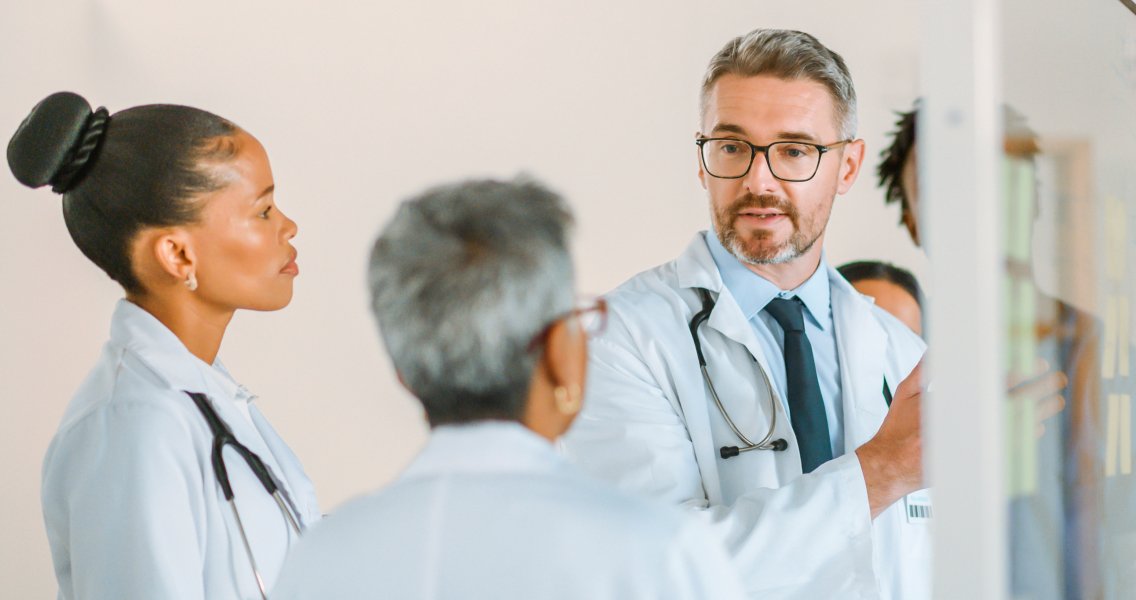 Oncologists discussing value-based care and the future of cancer care within an independent oncology practice.