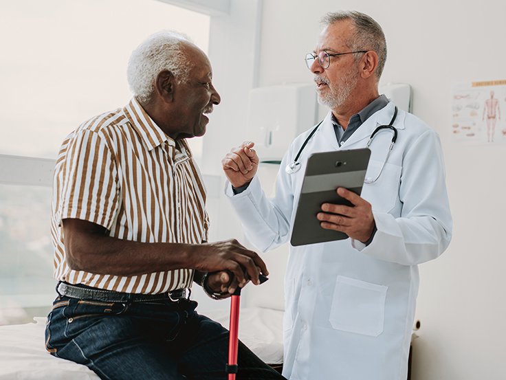 Doctor with patient smiling