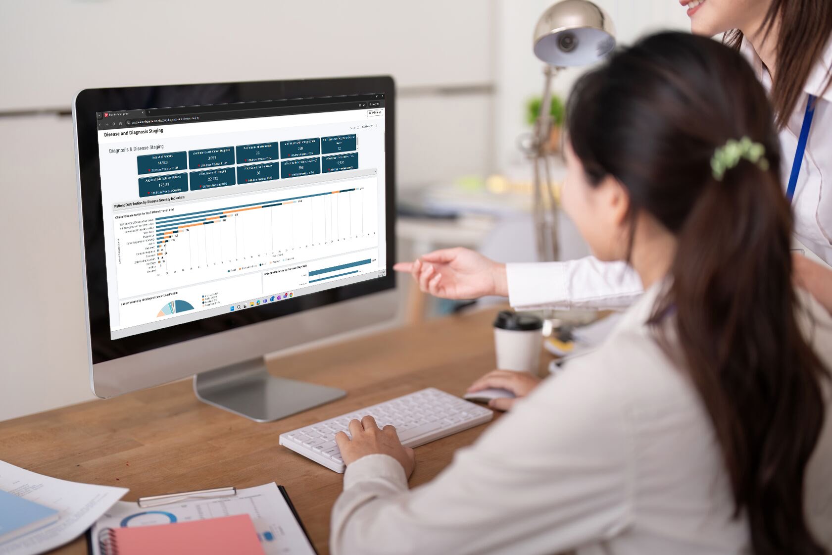 Oncologist viewing clinical dashboards through Navista™ Practice Intelligence