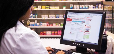 Pharmacist ordering from an online ordering system.