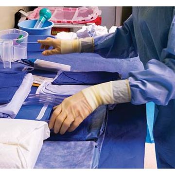 Medical professional sorting products for surgery.