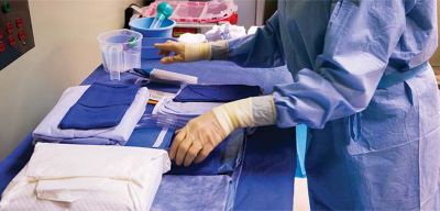 Medical professional sorting products for surgery.